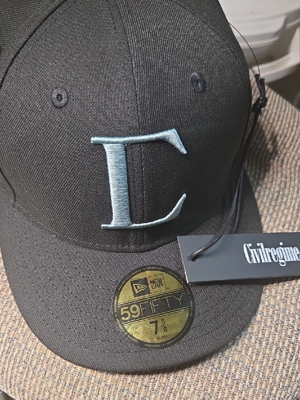 New Era Black Fitted Cap with Light Blue Embroidered 'F'
